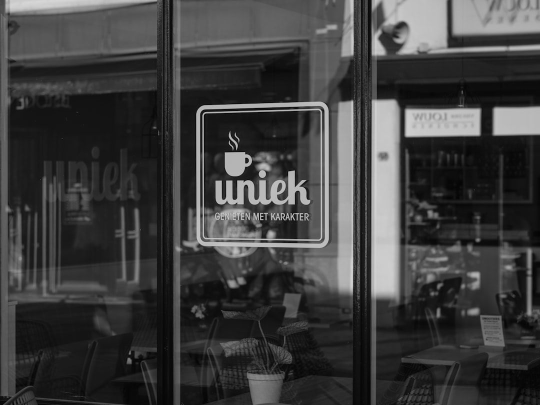 A cafe logo on a glass door